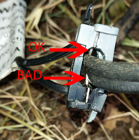 Photo shows one of two light power pins is not properly centered to push into the main power line.
