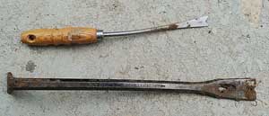Two tools are shown. The top tool is your typical weed tool. The bottom tool is a hand held crowbaar.